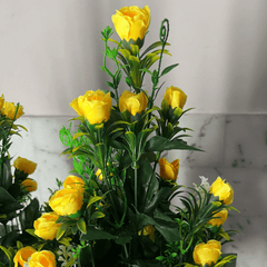 Elegant Yellow Flowers in Peach Planter Pot